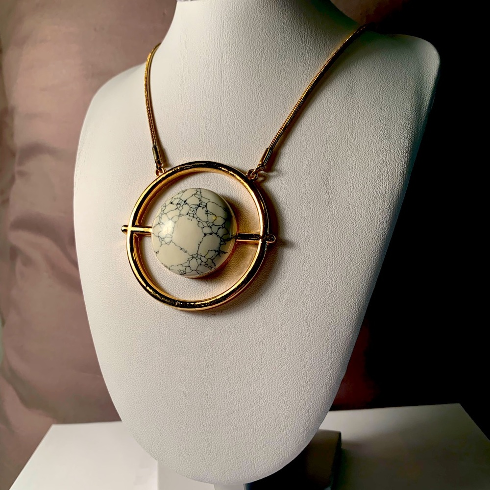 Long gold colored necklace